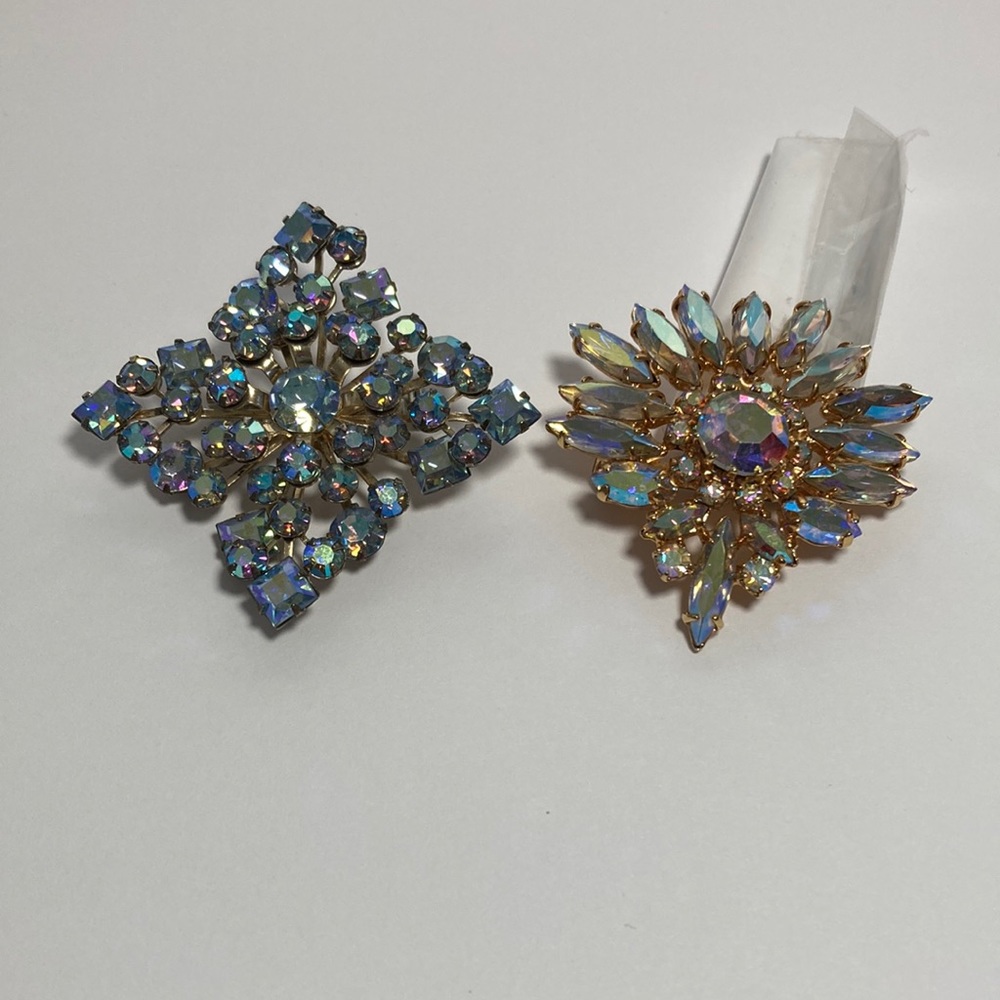 2 brooches one is a Triad signature cluster of rhinestones